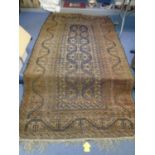 A hand woven Middle Eastern rug, faded red ground and multi guard boarders 272 x149cm