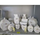 A set of porcelain storage jars with covers, wall hanging salt holders, jugs and other kitchenalia