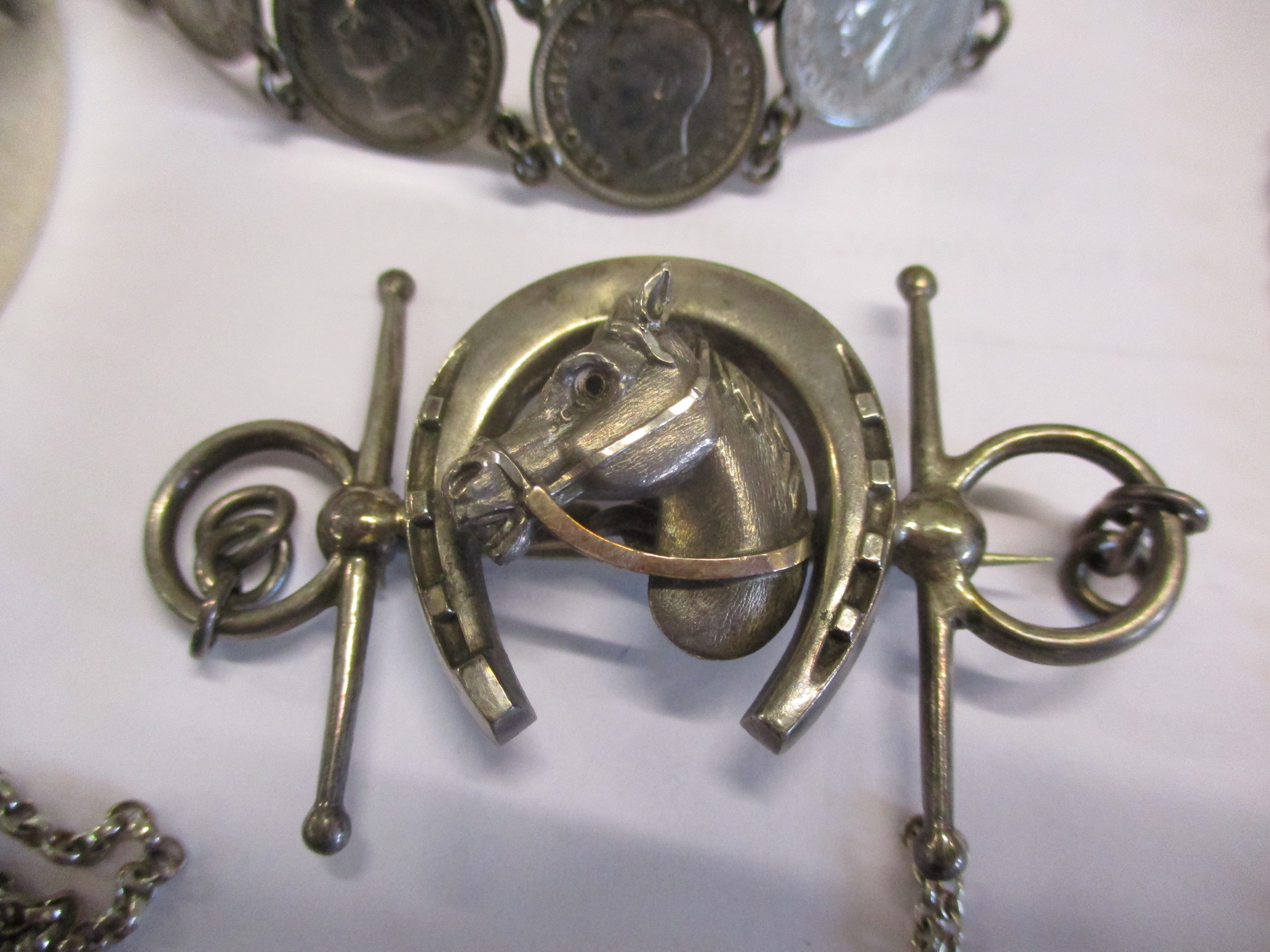 A silver fob watch chain, a silver ingot pendant on a white metal chain, two silver bangles and - Image 6 of 6