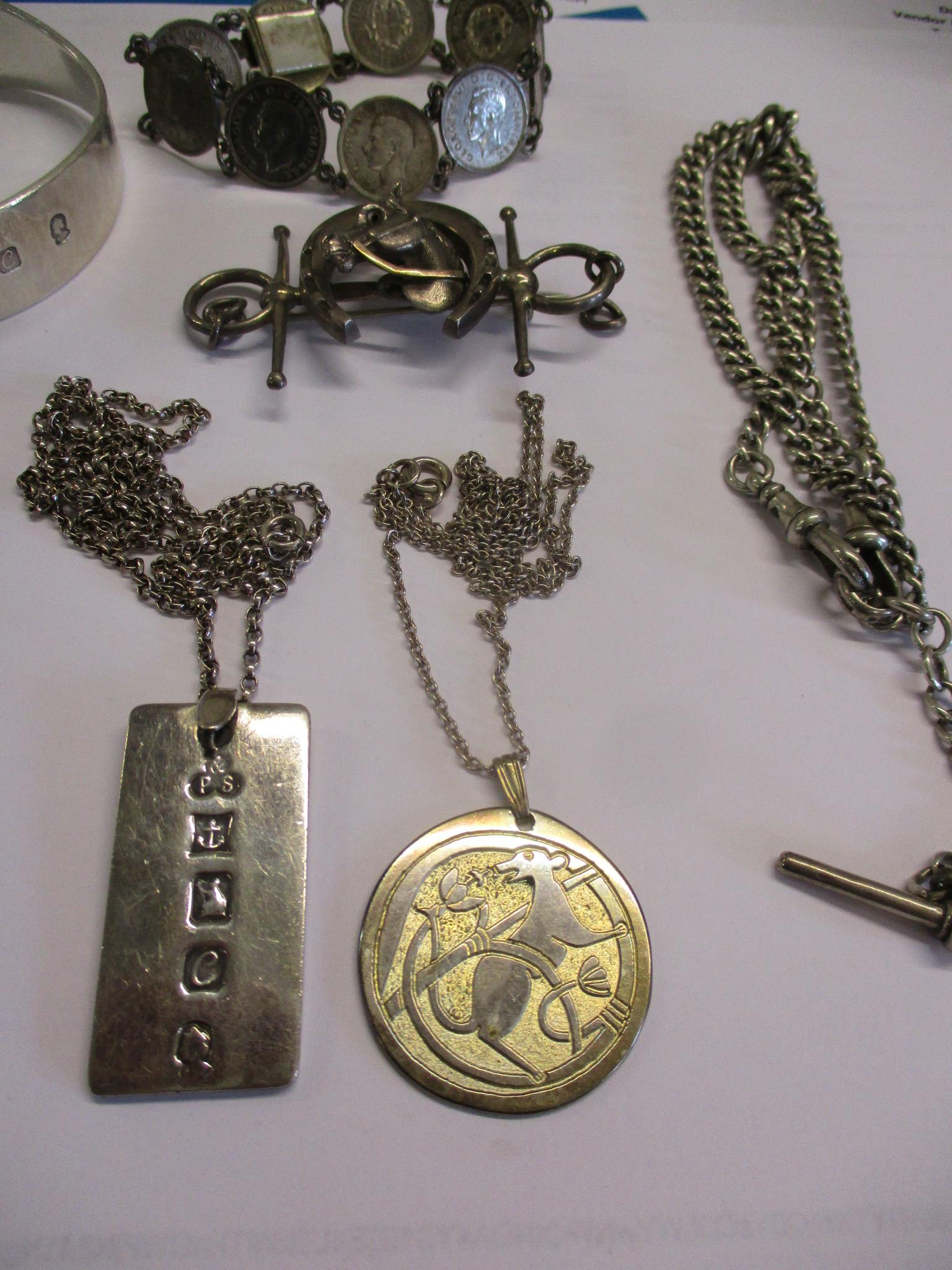 A silver fob watch chain, a silver ingot pendant on a white metal chain, two silver bangles and - Image 4 of 6