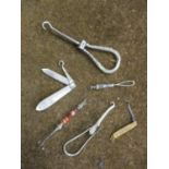 A small lot comprising a silver and mother of pearl fruit knife, a silver and agate button hook,