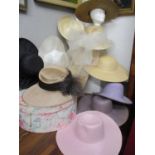 Eleven straw and natural fibre hats in various colours to include a Peter Bettley hat with white