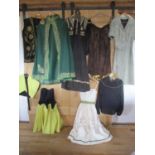 Middle Eastern inspired 1970's ladies clothing to include a green cape with gold coloured brocade