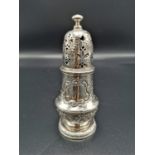 A George I silver pounce pot, London 1726, partial maker's mark ?W, with foliate pierced domed