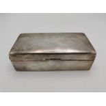 A George V silver cigarette box, Chester 1919, or rectangular form, the lid with Latin inscribed