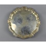 A George V silver salver by Mappin & Webb, Sheffield 1917, with thick pie crust edge, supported on