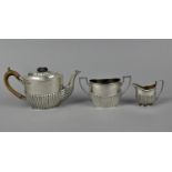 A late Victorian silver teapot and sugar bowl by Robert Pringle & Sons, London 1899, with part