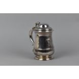 A George II silver lidded tankard by Richard Gurney & Thomas Cook, London 1750, with a hinged, domed