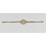 A 9ct gold ladies wristwatch, the face signed 'Philippe', with box clasp, 18 cm long