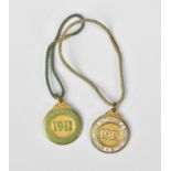 Two Brooklands Automobile Racing Club medals, one with green enamel, the other white, numbers to the