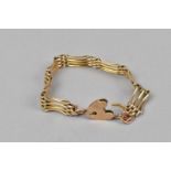 A 9ct gold gate link bracelet, with heart shaped padlock clasp and safety chain, 13 g