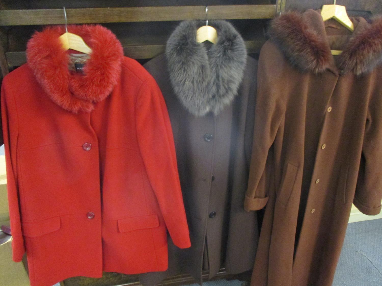 Three modern ladies coats with faux fur collars to include a Max Mara cream tunic, a Cerruti 1881