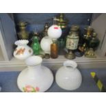 A collection of 20th century oil lamps A/F with various glass funnels, reservoirs and shades