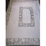 A small quantity of tablecloths and napkins to include early 20th century tablecloths with crochet