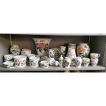 A large collection of Portmeirion Botanic Garden porcelain vases and storage jars, bowls, jug,