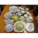 A Doulton tea service, four dinner plates and salt and pepper shakers, together with mixed teacups