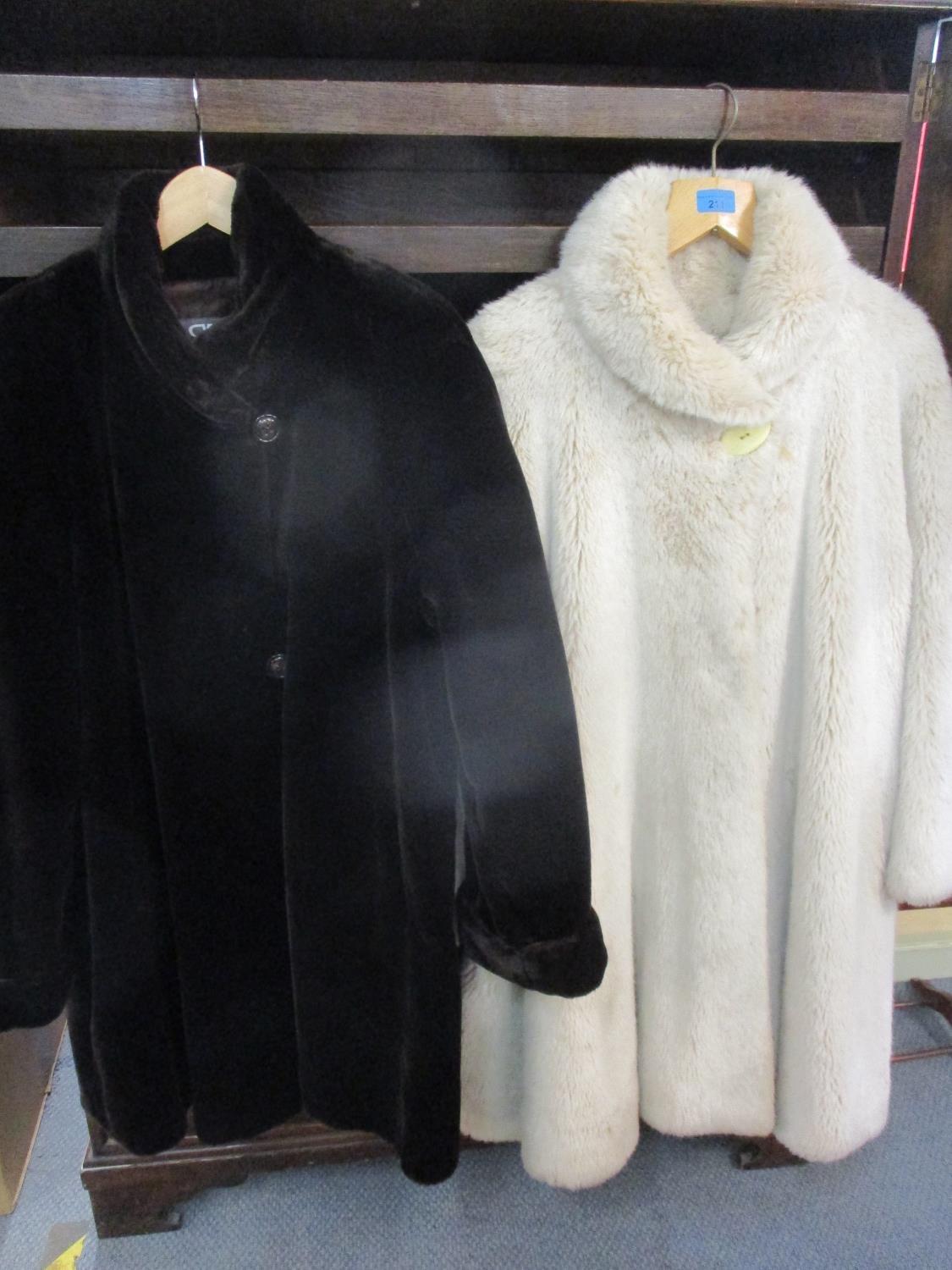 A Glenn Models Inc faux fur ladies swing coat in beige, together with a Basler faux fur ladies coat,