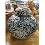 A 20th century Chinese blue and white porcelain lidded ginger jar, of globular form with domed