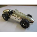 A solid silver model of a vintage racing car, marked 925 Location: Cab