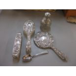 A matched silver dressing table set, together with a silver spoon Location: 5:2