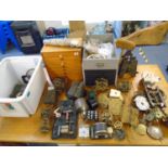 A selection of clock movements and other parts, small wooden chests for clock spares and other items