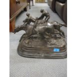 A bronze figural group on stepped marble base of two jockeys on racehorses galloping signed E...