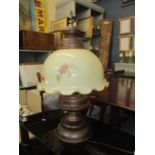 A vintage brass and oak lamp with floral opaque shade 79cm h Location: C-R