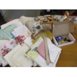 A collection of vintage table linen, a sewing box to include Coats and Sylko cotton reels, an