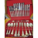 A canteen of A1 silver plated Kings pattern six-setting cutlery and flatware in a mid oak box