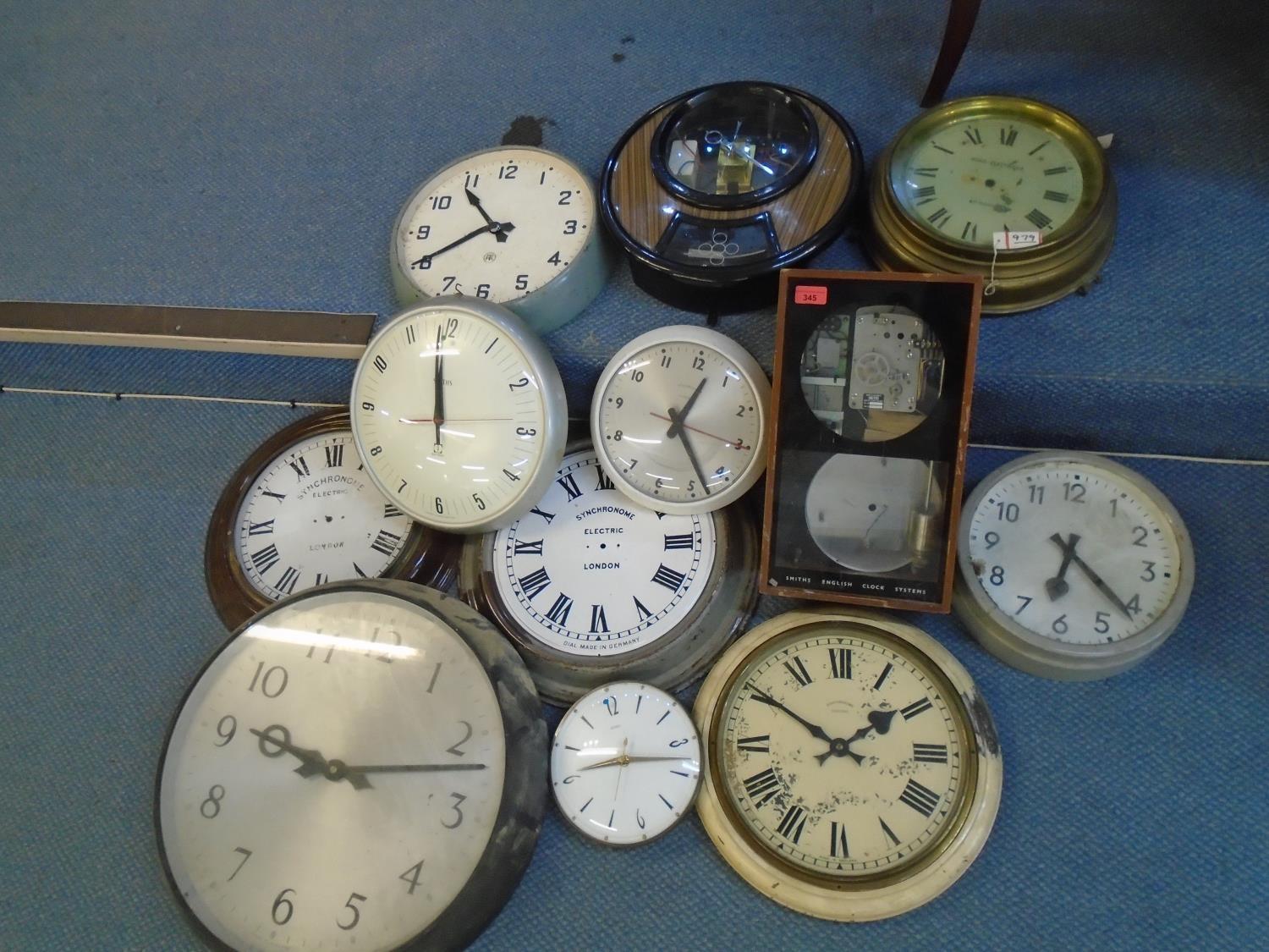 A selection of wall clocks and a Smiths English Clock Systems master clock, circa 1960's, to include