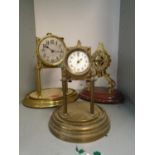 A group of three anniversary clocks to include a Gustave Becker clock, and two others, one