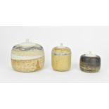 Judith Gilmour (b.1937) British Three stoneware studio pottery lidded jars, of various sizes, all