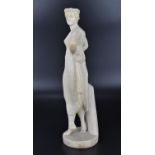 A late 19th century alabaster sculpture of a Classical maiden with draped clothing and floral