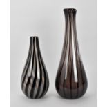 Two hand blown Anthony Stern studio glass vases, of elongated form with bulbous base and twisted