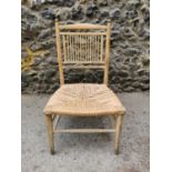 An Arts and Crafts carved ash Sussex chair, probably designed by Morris & Co, with turned spindle