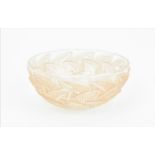 A Rene Lalique frosted and clear pink tinted bowl in the 'Ormeaux' pattern, the underside stencilled