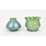 A Loetz style iridescent green glass vase, of bulbous form with spotted papillon pattern throughout,