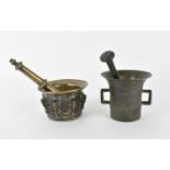 An 18th century or earlier Middle Eastern bronze mortar and pestle, modelled with flanged decoration