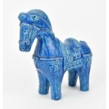 An Italian Bitossi rimini blue glazed pottery model of a horse, with incised decoration, the