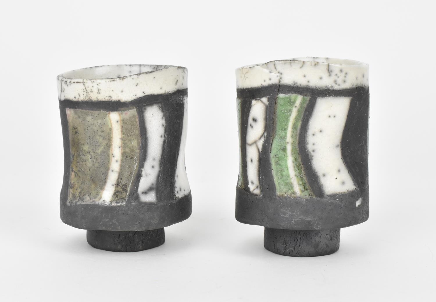 Elizabeth Raeburn (b.1943) British a pair of raku pottery footed cups of tubular form with raised