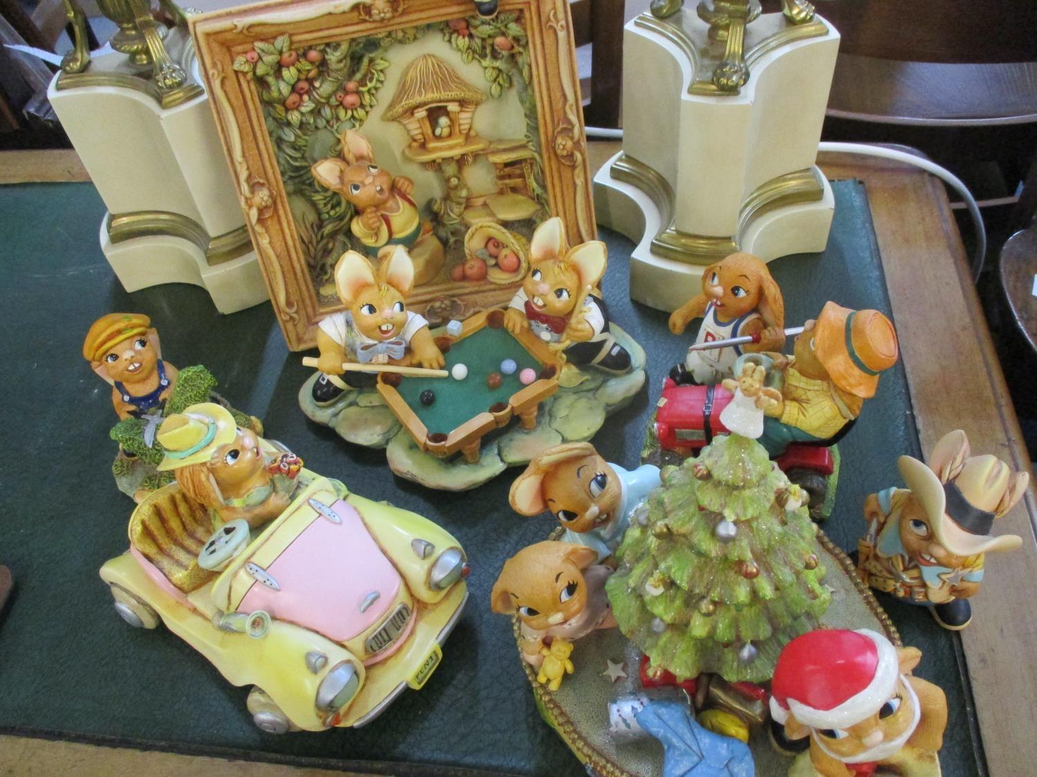 A quantity of PenDelfin models of rabbit characters to include a musical Christmas display, a framed