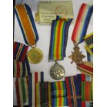 A group of three WWI medals to 3381 Pte. L Griggs Middx R, along with additional ribbons Location: