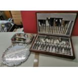 A sterling silver mounted glass atomiser, together with a cased canteen of silver plated cutlery for