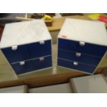 A four drawer and a three drawer table top filing cabinet