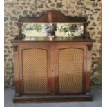 A regency rosewood mirrored back chiffonier, surmounted with a moulded pediment, the cabinet with