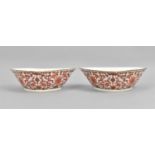 A pair of Chinese Daoguang period shaped dishes, each with gilt rim and red iron foliate scrolls