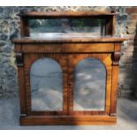 A William IV rosewood chiffonier, with mirrored back , the bottom part with twin doors, each with