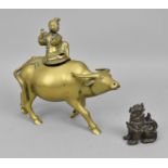 A Chinese turn of the century brass model of a sage on a water buffalo, 22 cm high x 22 cm wide,