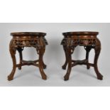 A pair of Chinese carved hardwood and marble jardiniere stands, with beaded rim and pierced