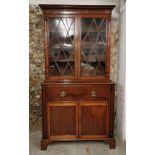 A Regency mahogany bureau bookcase, with moulded cornice above two astragal glazed doors enclosing